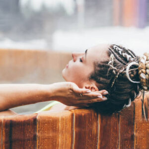 Woman chilling in hot tub.